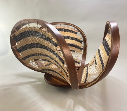 Trefoil-Weave-Bentwood-Table-Base-Brandy-Clements-Wvl-Safari-Resized.jpeg steam bent trefoil table base, woven with black and natural cane in a basket weave pattern